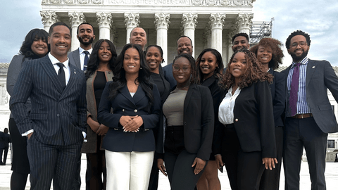 Judicial externship participants standing together outside the U.S. Supreme Court building.