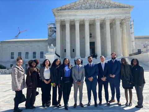 lawyers standing outside a courthouse